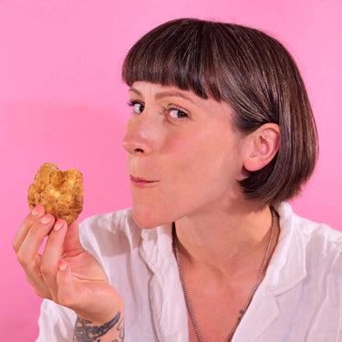Woman enjoying a freshly baked 6 x New York Cookies, Cupcake Jemma's Favourites from Crumbs & Doilies.